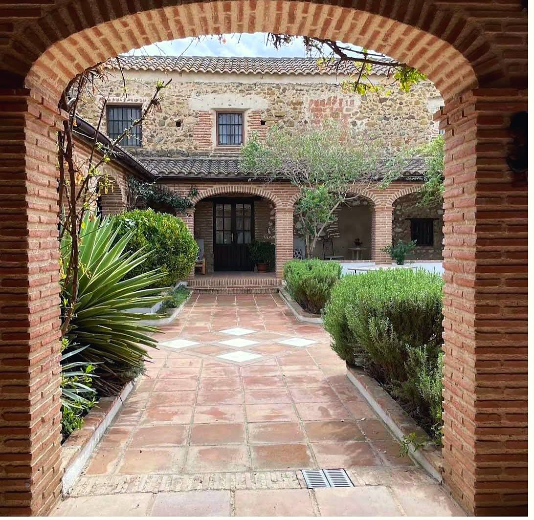 Brick archway onto the herb garden